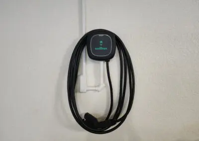 EV wall charger with a cord attached to it.