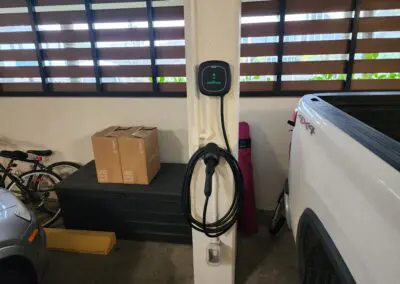 An electric car charging station in a garage.